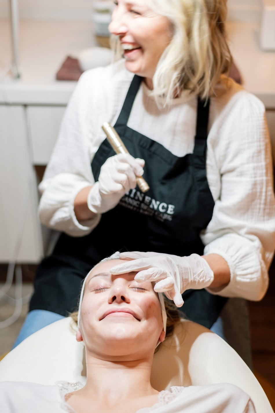 A shared laugh during a microcurrent facial